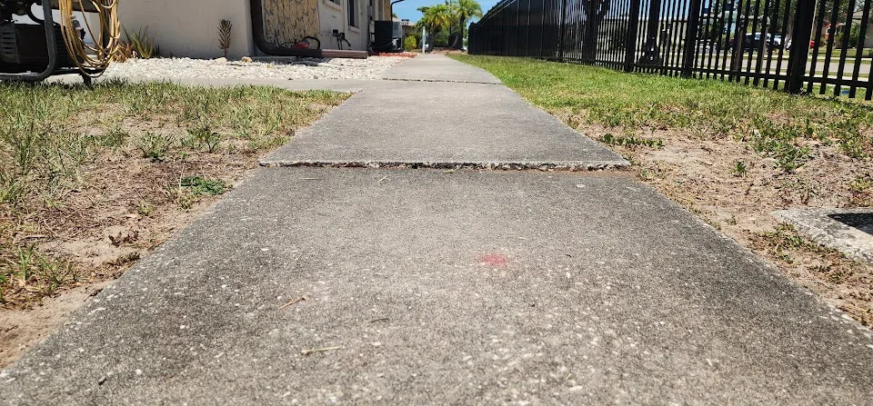 Uneven sidewalk trip hazard in Port Charlotte Florida