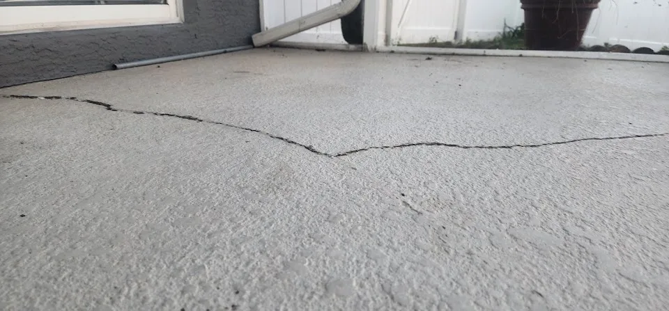 Cracked and settling pool deck concrete in Florida