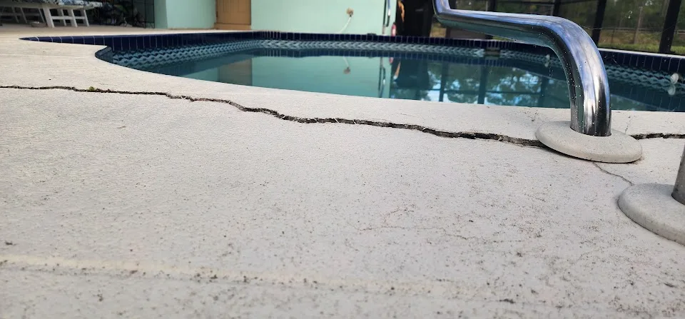 Sinking and cracked concrete pool deck in Tampa Bay Florida