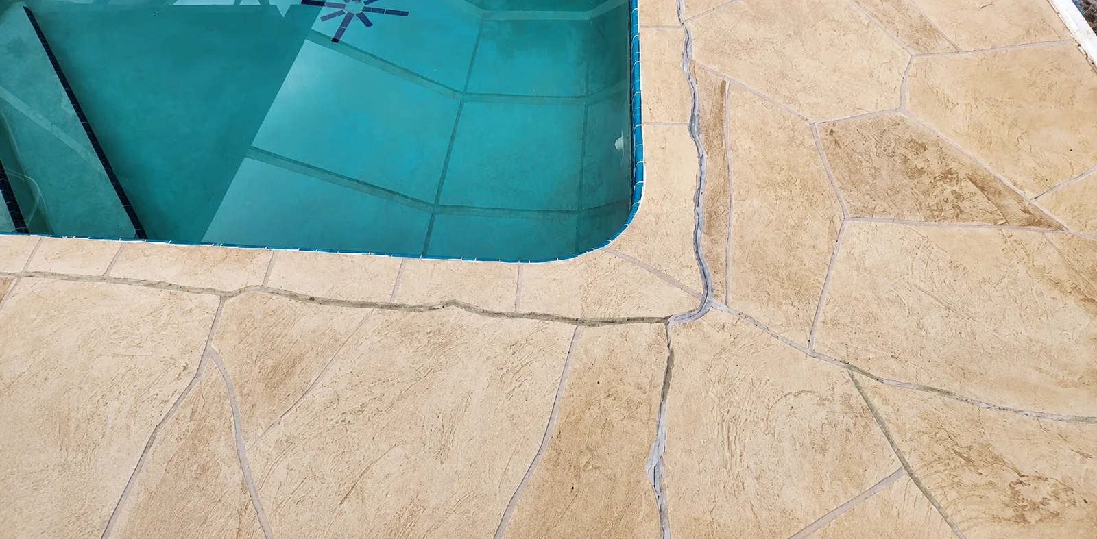 Sinking pool deck pulling away from swimming pool in Tampa Bay Florida